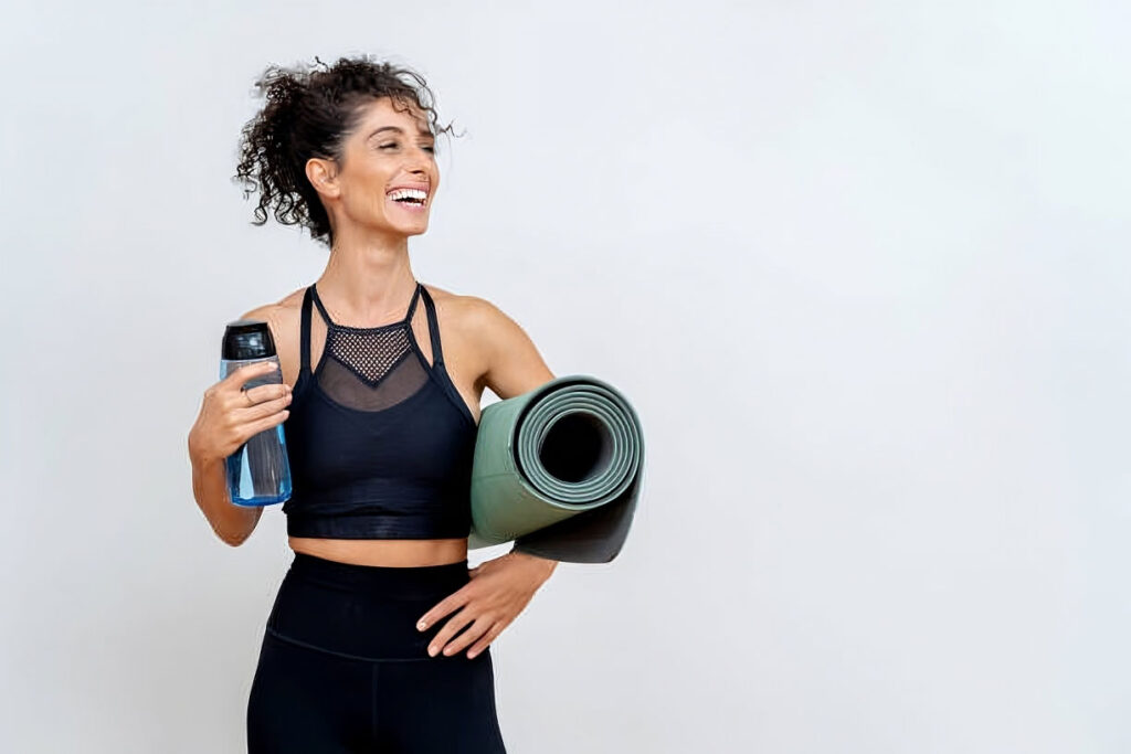 Woman performing Pilates core exercise on mat